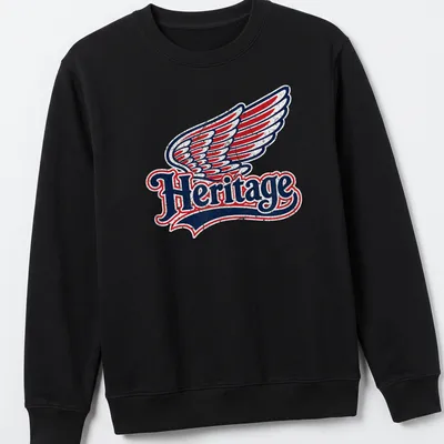 Vintage distressed t-shirt featuring the word Heritage and a wing graphic — printed on a unisex sweatshirt