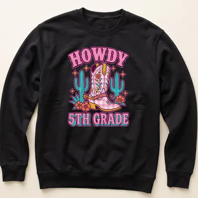 Colorful cartoon T-shirt featuring cowgirl boots and the phrase HOWDY 5TH GRADE — printed on a unisex sweatshirt
