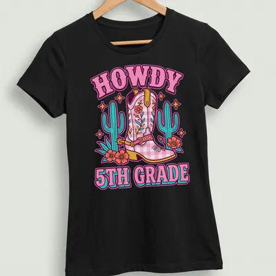 Colorful cartoon T-shirt featuring cowgirl boots and the phrase HOWDY 5TH GRADE — printed on a women's shirt