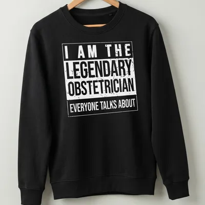 Bold typography t-shirt stating the legendary obstetrician everyone talks about — printed on a unisex sweatshirt