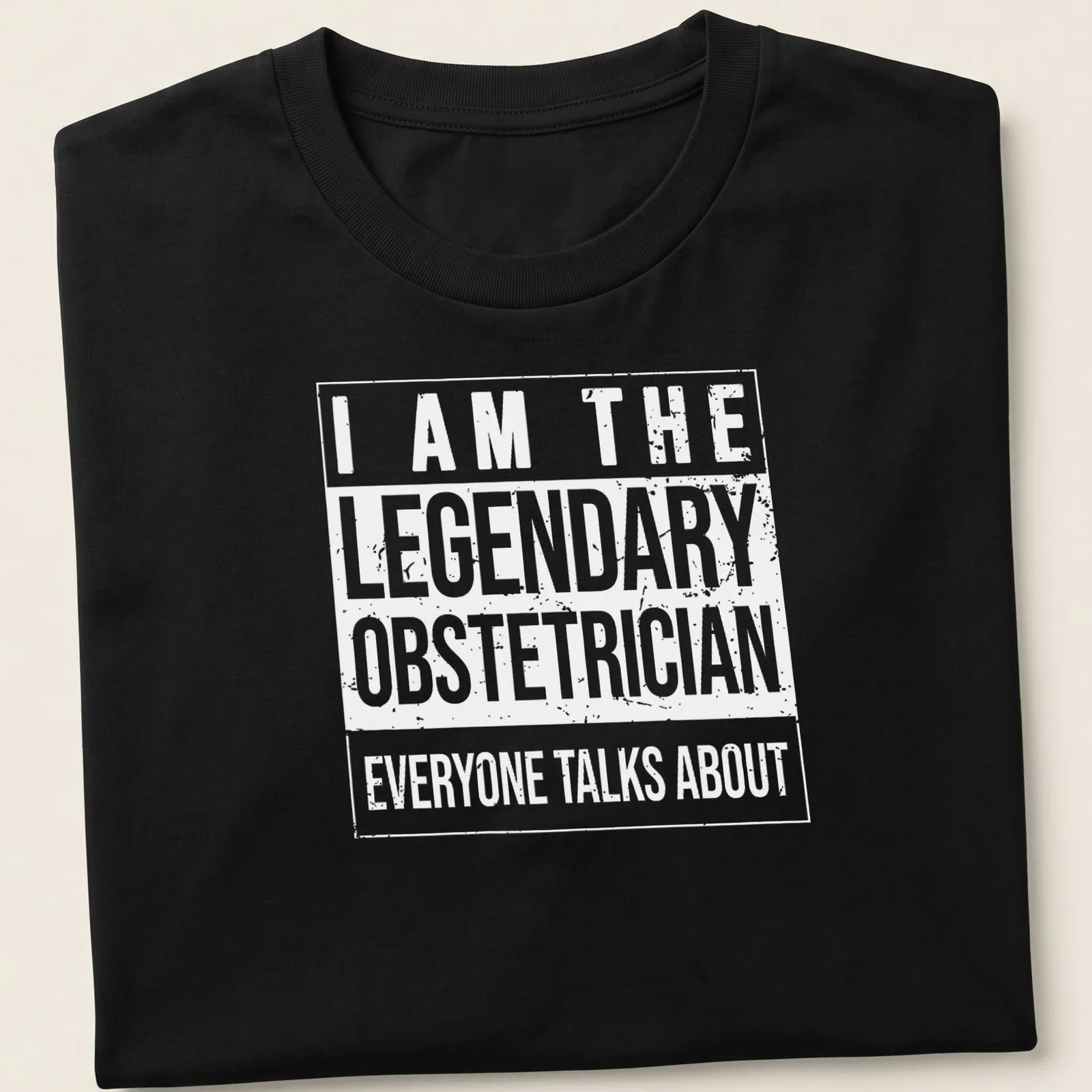 Bold typography t-shirt stating the legendary obstetrician everyone talks about — printed on a unisex t-shirt