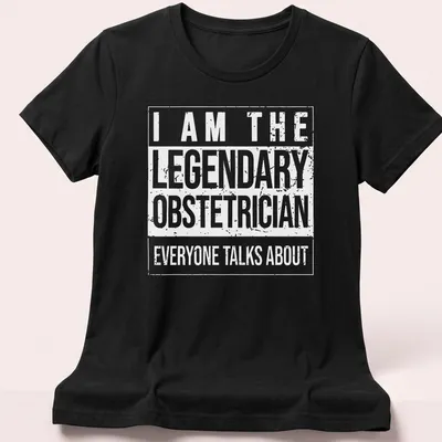 Bold typography t-shirt stating the legendary obstetrician everyone talks about — printed on a women's shirt