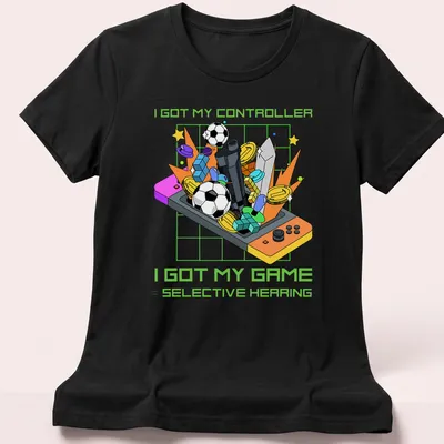 Colorful cartoon design featuring a video game controller and humorous text about gaming. — printed on a women's shirt