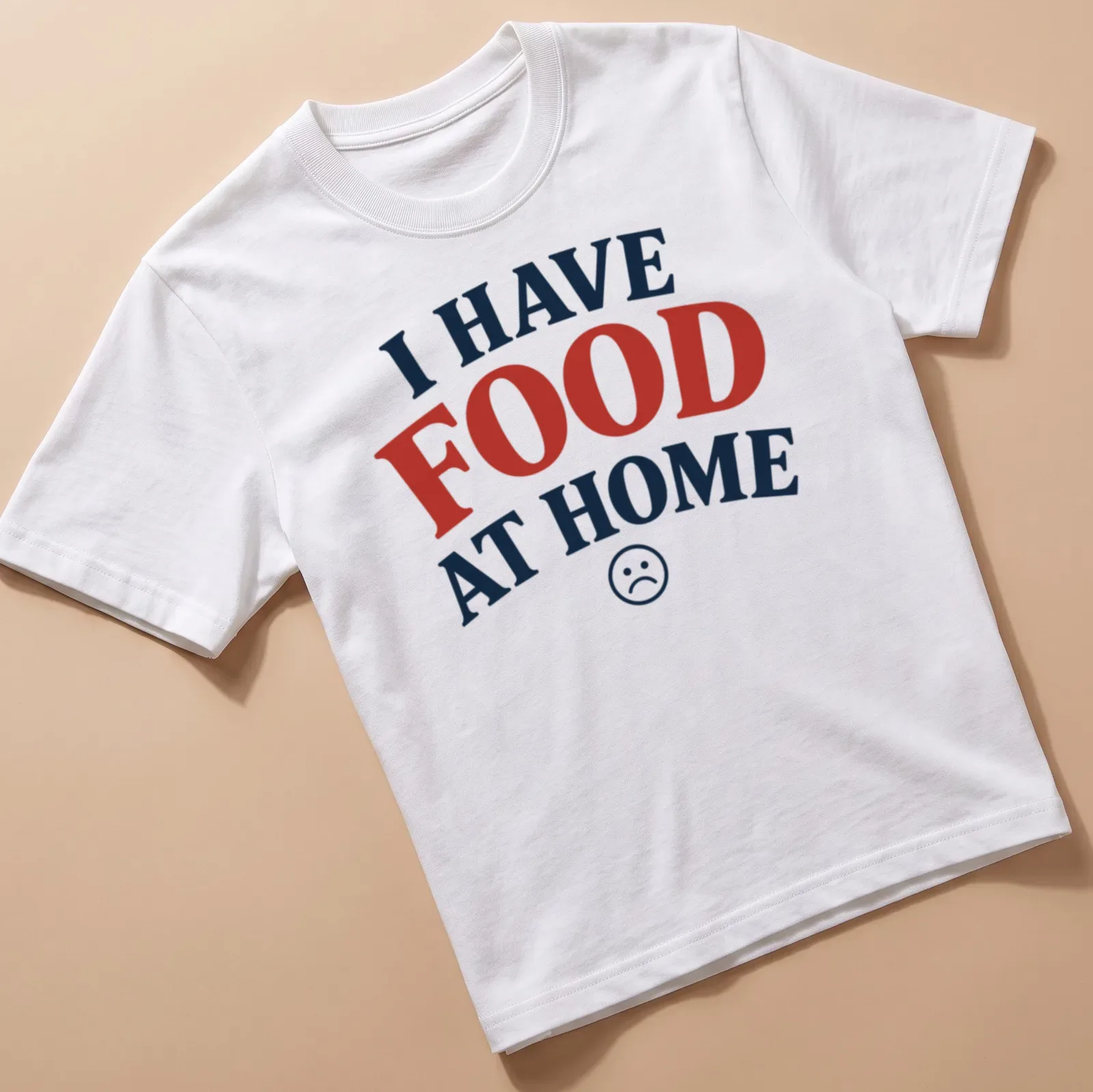 Bold typography t-shirt with sad face emoticon and humorous quote about food — printed on a unisex t-shirt