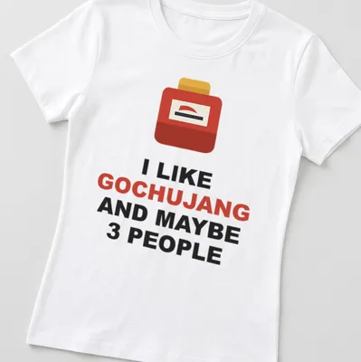 Minimalist T-shirt with bold text about gochujang and a container graphic — printed on a women's shirt