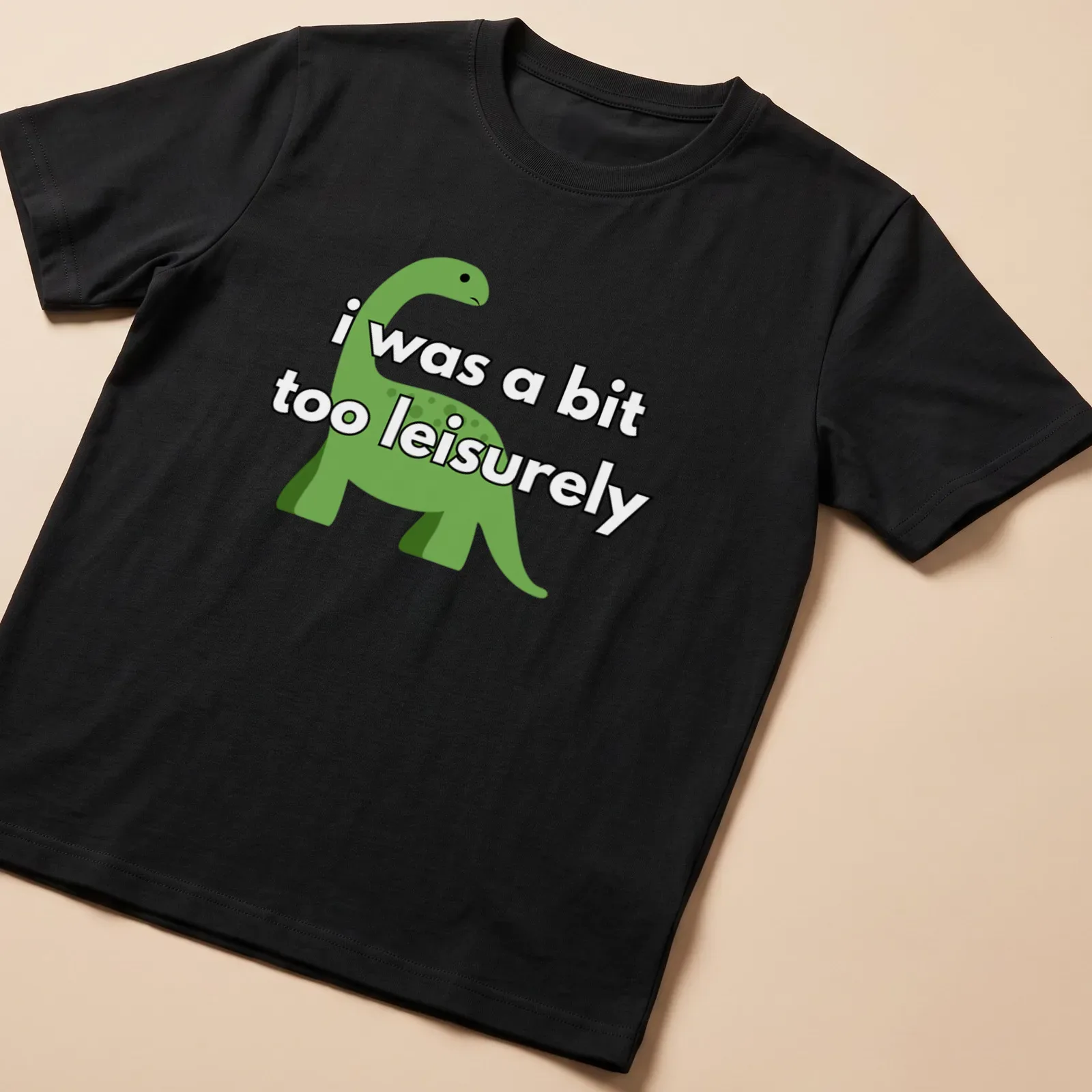 Cartoon dinosaur graphic with humorous text about being leisurely — printed on a unisex t-shirt