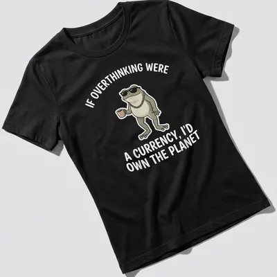 Cartoon frog with the text: If Overthinking Were A Currency, I'd Own The Planet — printed on a women's shirt