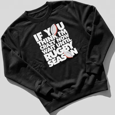 Minimalist print featuring a rugby ball with humorous text about rugby season — printed on a unisex sweatshirt