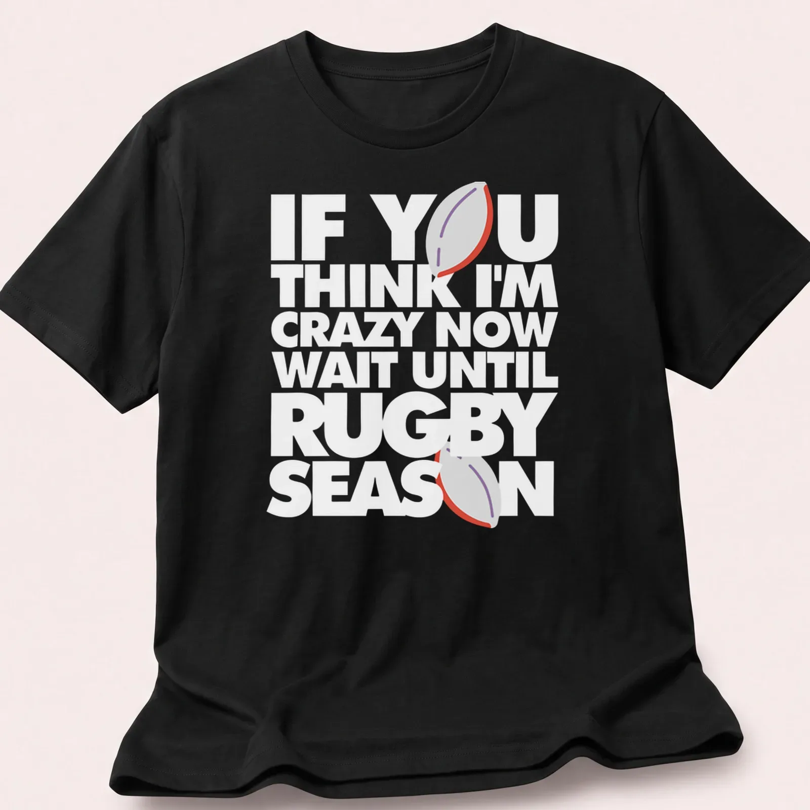 Minimalist print featuring a rugby ball with humorous text about rugby season — printed on a unisex t-shirt