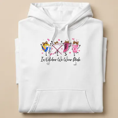 Kawaii cartoon design with volleyball, pink sneaker, pink drink, and awareness ribbons — printed on a unisex hoodie