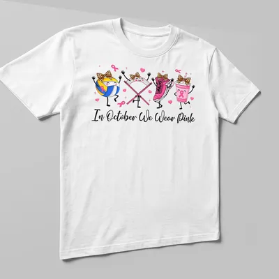 Kawaii cartoon design with volleyball, pink sneaker, pink drink, and awareness ribbons — printed on a unisex t-shirt (angled view)