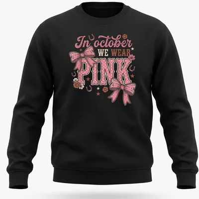 Playful T-shirt with a colorful Western bow and text about October wearing pink — printed on a unisex sweatshirt