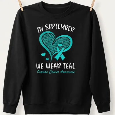 Teal Ovarian Cancer Awareness shirt with teal ribbon and heart design — printed on a unisex sweatshirt