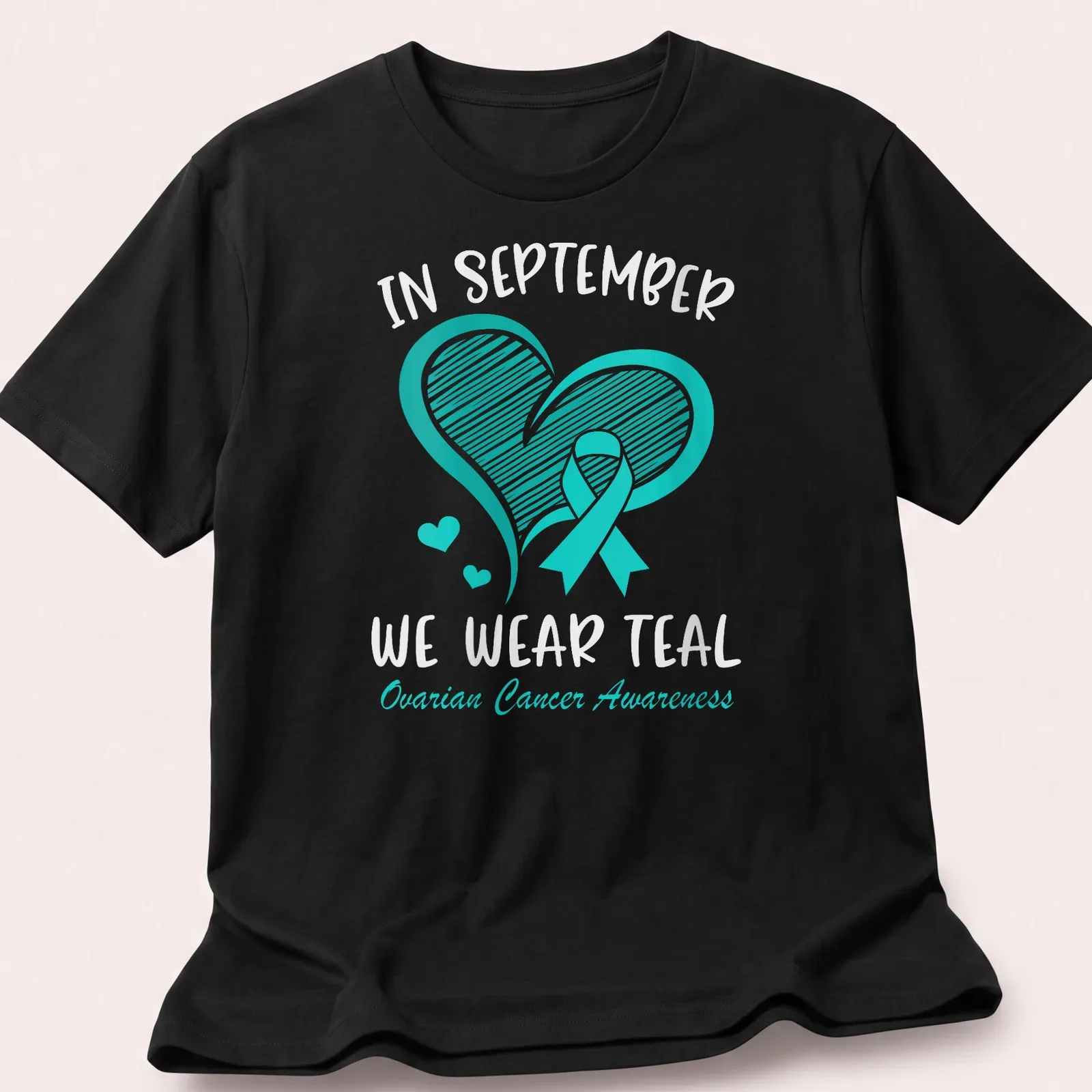 Teal Ovarian Cancer Awareness shirt with teal ribbon and heart design — printed on a unisex t-shirt