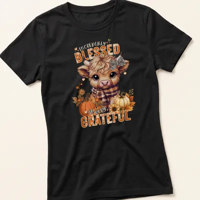 Kawaii Highland cow design with colorful text expressing gratitude — printed on a women's shirt