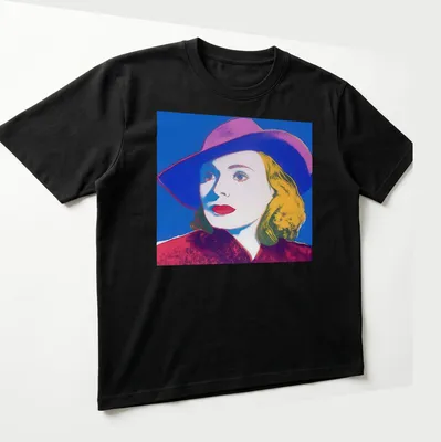 Pop Art portrait of Ingrid Bergman with hat in vibrant colors — printed on a unisex t-shirt (angled view)