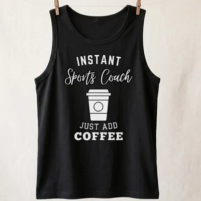 Bold typography shirt with 'Instant Sports Coach Just Add Coffee' text above a coffee cup graphic. — printed on a tank top