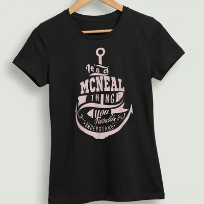 Vintage graphic tee featuring a fishing hook and fish with humor about the McNeal family. — printed on a women's shirt