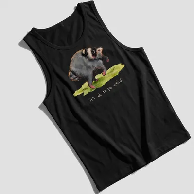 Watercolor print of a raccoon with the text it's ok to be weird in soft colors. — printed on a tank top