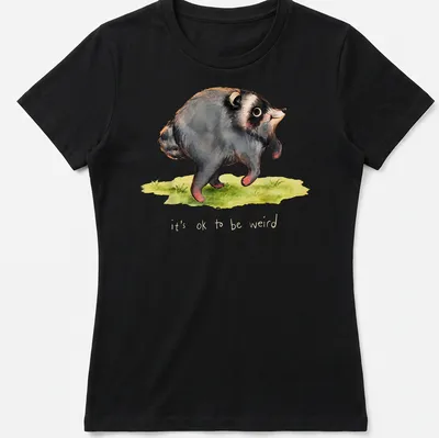 Watercolor print of a raccoon with the text it's ok to be weird in soft colors. — printed on a women's shirt