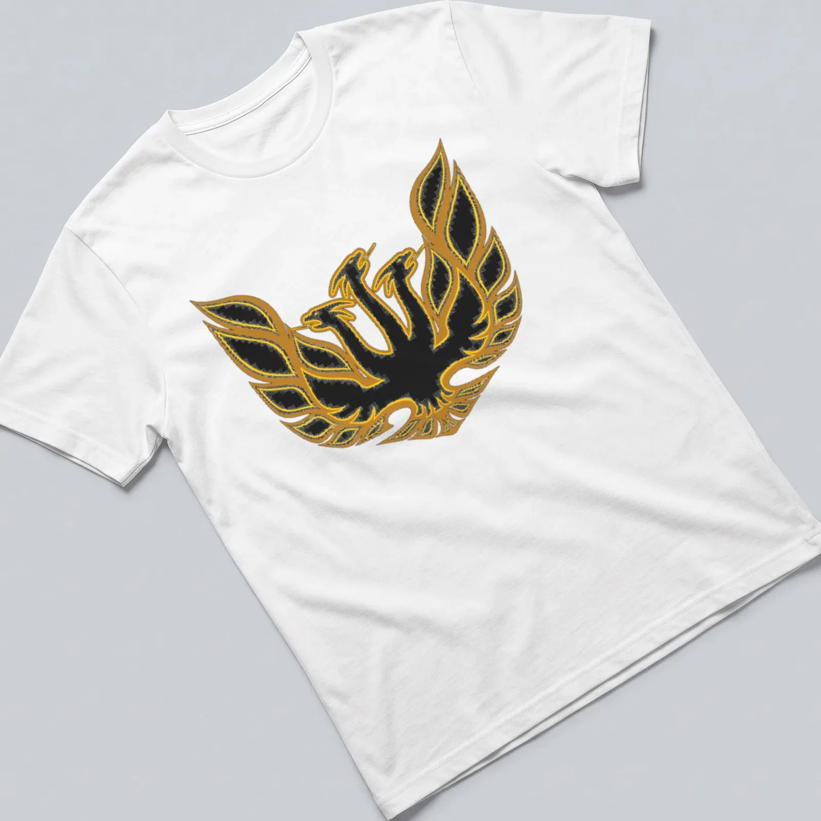 Bold graphic of King Ghidorah with golden wings on a black background — printed on a unisex t-shirt