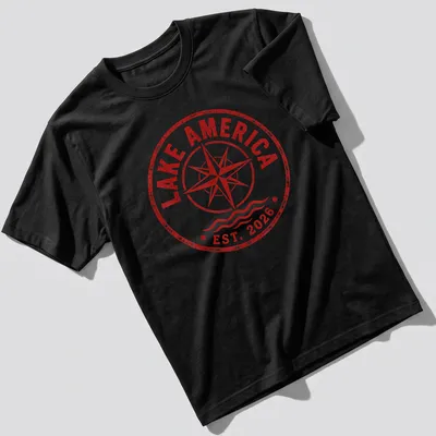 Vintage distressed shirt featuring a compass design with red and white text.