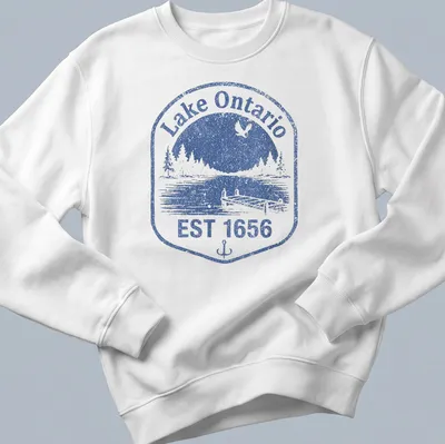 Vintage distressed Lake Ontario dock scene with blue and white colors and established date. — printed on a unisex sweatshirt