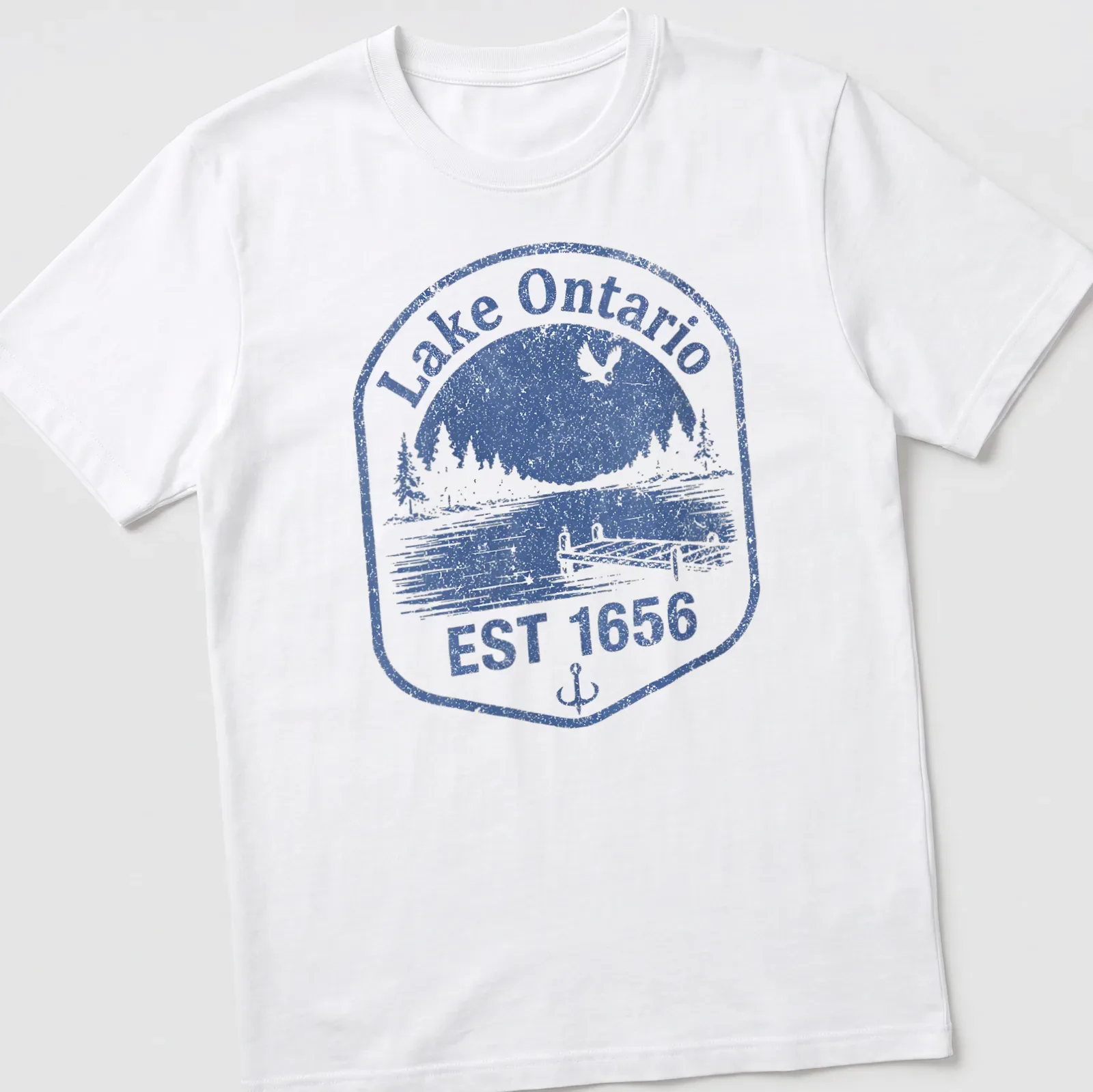 Vintage distressed Lake Ontario dock scene with blue and white colors and established date. — printed on a unisex t-shirt