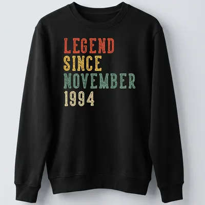 Vintage distressed birthday celebration tee with colorful text proclaiming legendary status — printed on a unisex sweatshirt