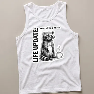 Vintage illustration of a raccoon with text reading Life Update: everything hurts in black, white, and gray — printed on a tank top
