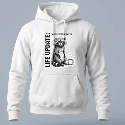 Vintage illustration of a raccoon with text reading Life Update: everything hurts in black, white, and gray — printed on a unisex hoodie