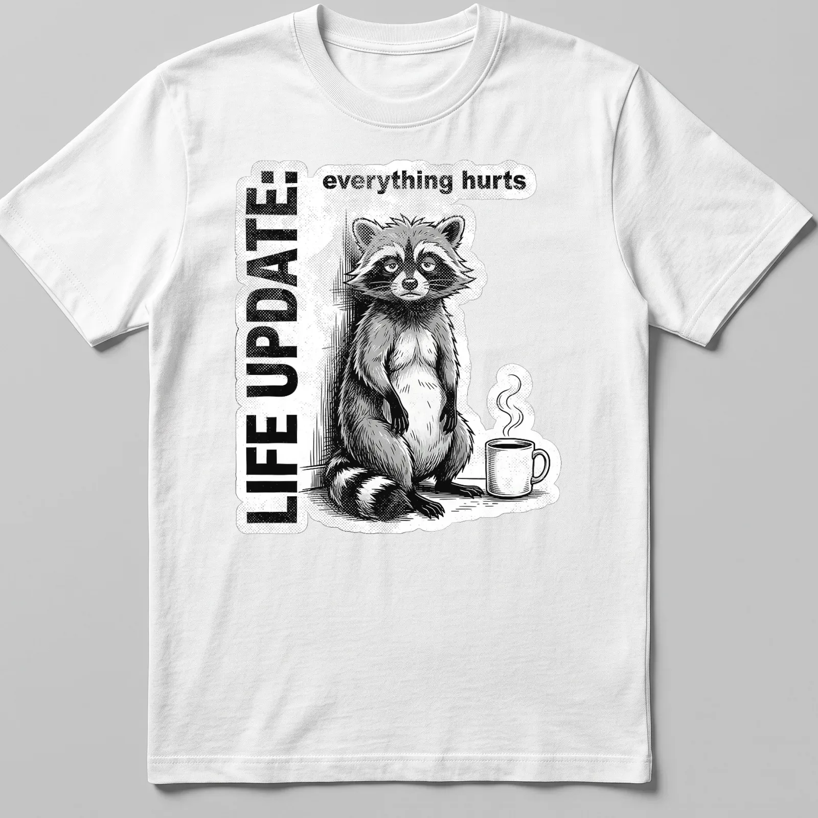 Vintage illustration of a raccoon with text reading Life Update: everything hurts in black, white, and gray — printed on a unisex t-shirt