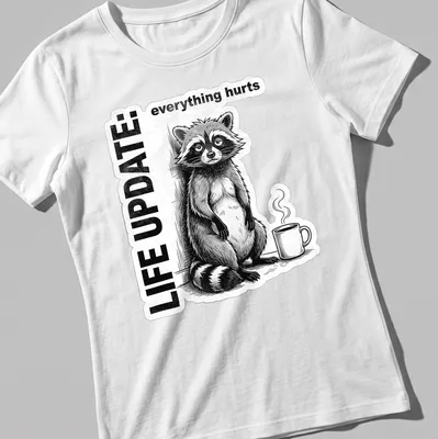 Vintage illustration of a raccoon with text reading Life Update: everything hurts in black, white, and gray — printed on a women's shirt