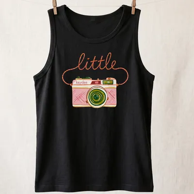 Watercolor design of a camera with the text 'little kaydee' in pink and green hues — printed on a tank top