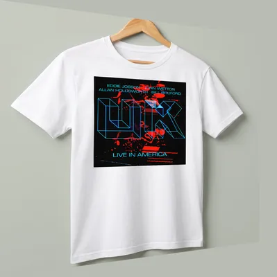 Neon geometric band names and live concert text in bright colors on black — printed on a unisex t-shirt (angled view)