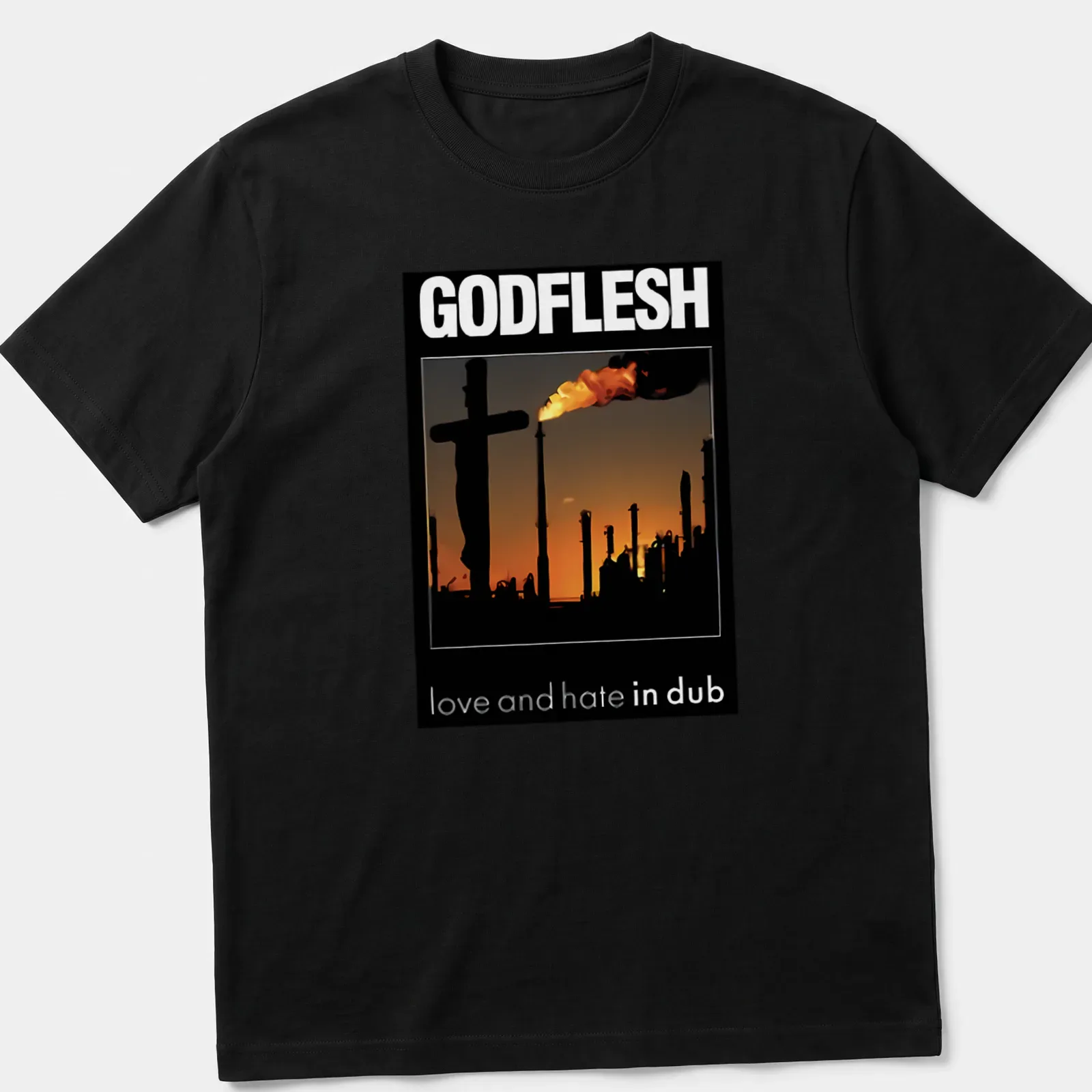 Silhouette of an industrial landscape with a cross and smokestacks under bold text — printed on a unisex t-shirt