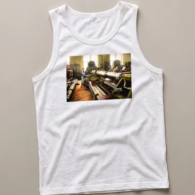 Vintage T-shirt depicting a machinist at a lathe with retro typography — printed on a tank top