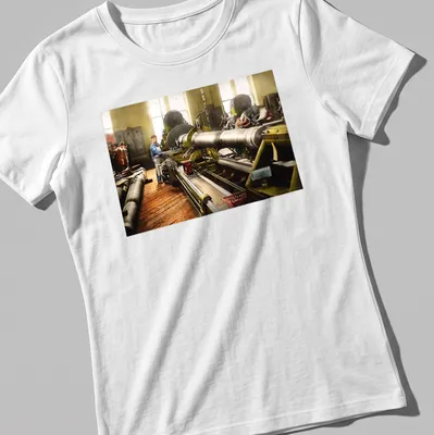 Vintage T-shirt depicting a machinist at a lathe with retro typography — printed on a women's shirt
