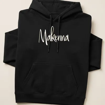 Personalized T-shirt with the name Makenna in elegant gold script — printed on a unisex hoodie