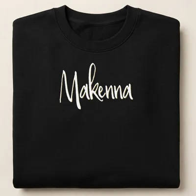 Personalized T-shirt with the name Makenna in elegant gold script — printed on a unisex sweatshirt