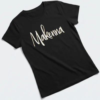 Personalized T-shirt with the name Makenna in elegant gold script — printed on a women's shirt