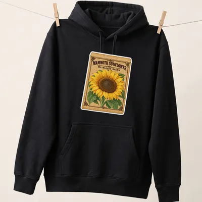 Vintage design featuring a sunflower and the text Mammoth Sunflower Heirloom Seeds in yellow and brown — printed on a unisex hoodie