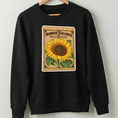 Vintage design featuring a sunflower and the text Mammoth Sunflower Heirloom Seeds in yellow and brown — printed on a unisex sweatshirt
