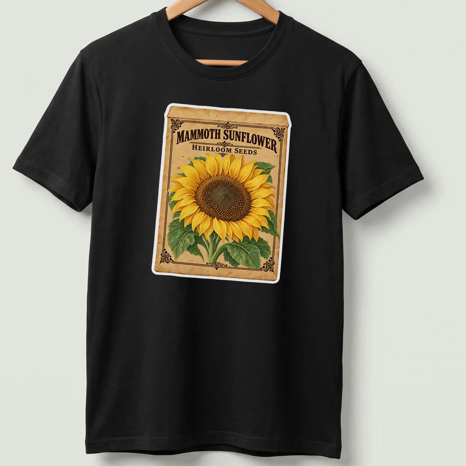 Vintage design featuring a sunflower and the text Mammoth Sunflower Heirloom Seeds in yellow and brown — printed on a unisex t-shirt