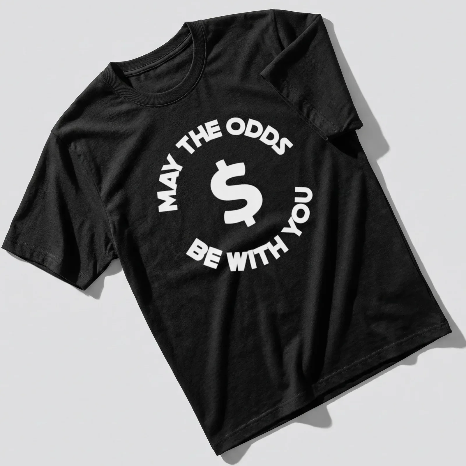 Bold lettering of 'May The Odds Be With You' on a sports betting — printed on a unisex t-shirt