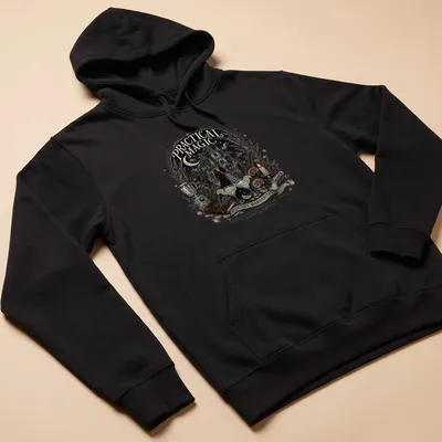 Whimsical Halloween t-shirt featuring witches and cocktails with vibrant colors — printed on a unisex hoodie
