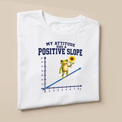 Cheerful cartoon frog holding a flower with positive message text — printed on a unisex t-shirt (angled view)