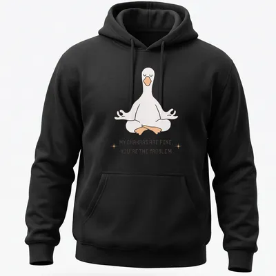 Kawaii line-art of a meditating goose with the phrase about chakras above it. — printed on a unisex hoodie