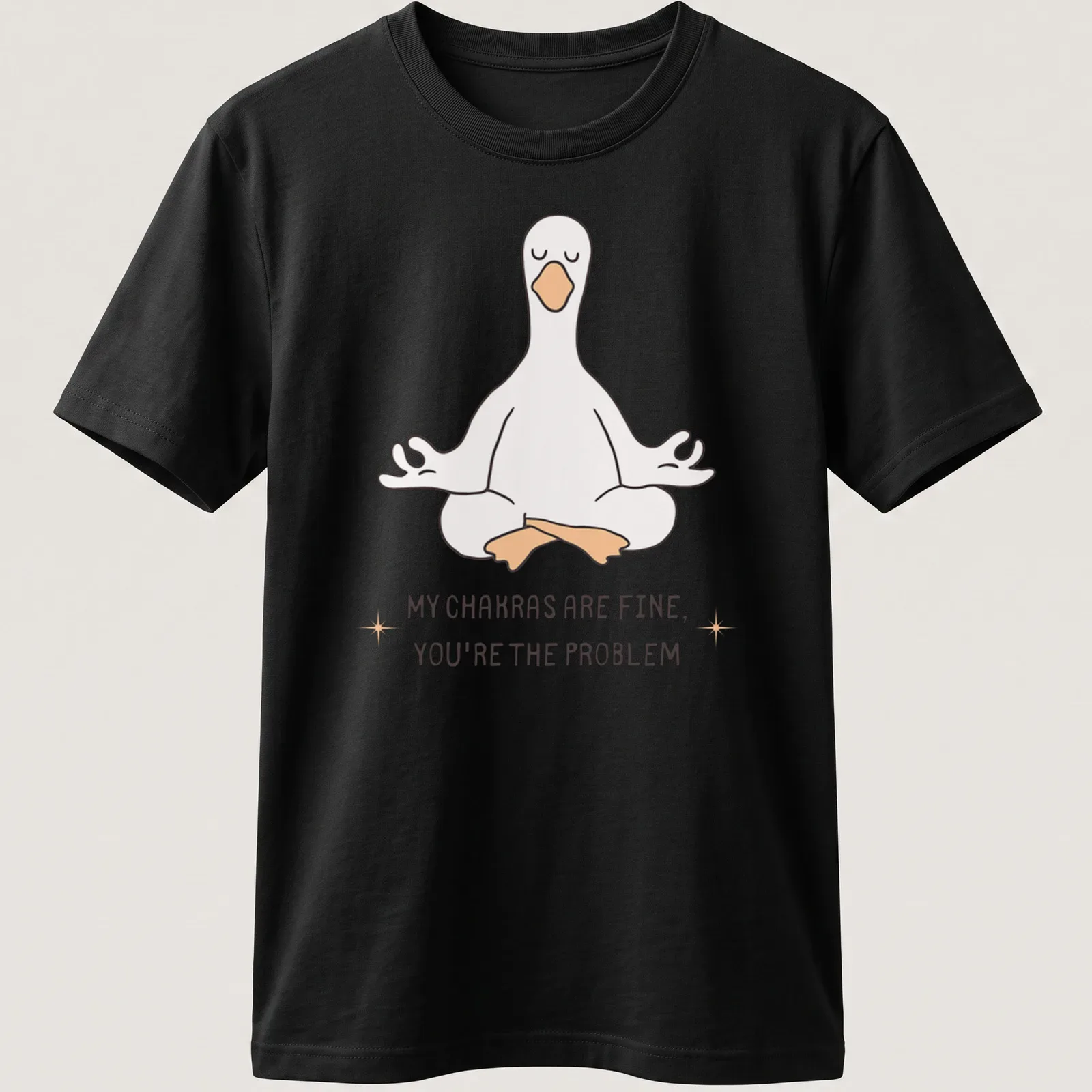 Kawaii line-art of a meditating goose with the phrase about chakras above it. — printed on a unisex t-shirt