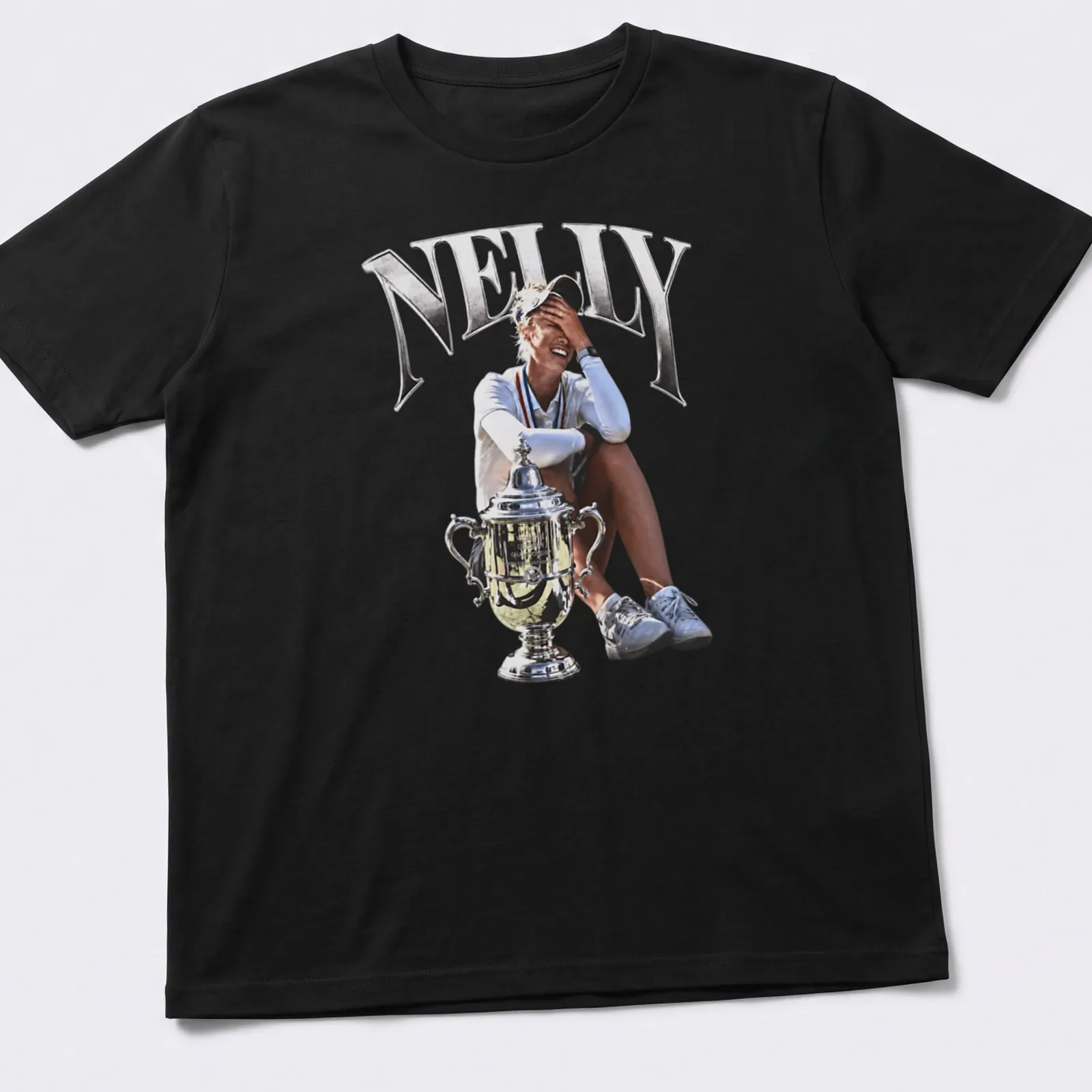 Photographic print of female golfer Nelly Korda holding a trophy, in silver and black — printed on a unisex t-shirt